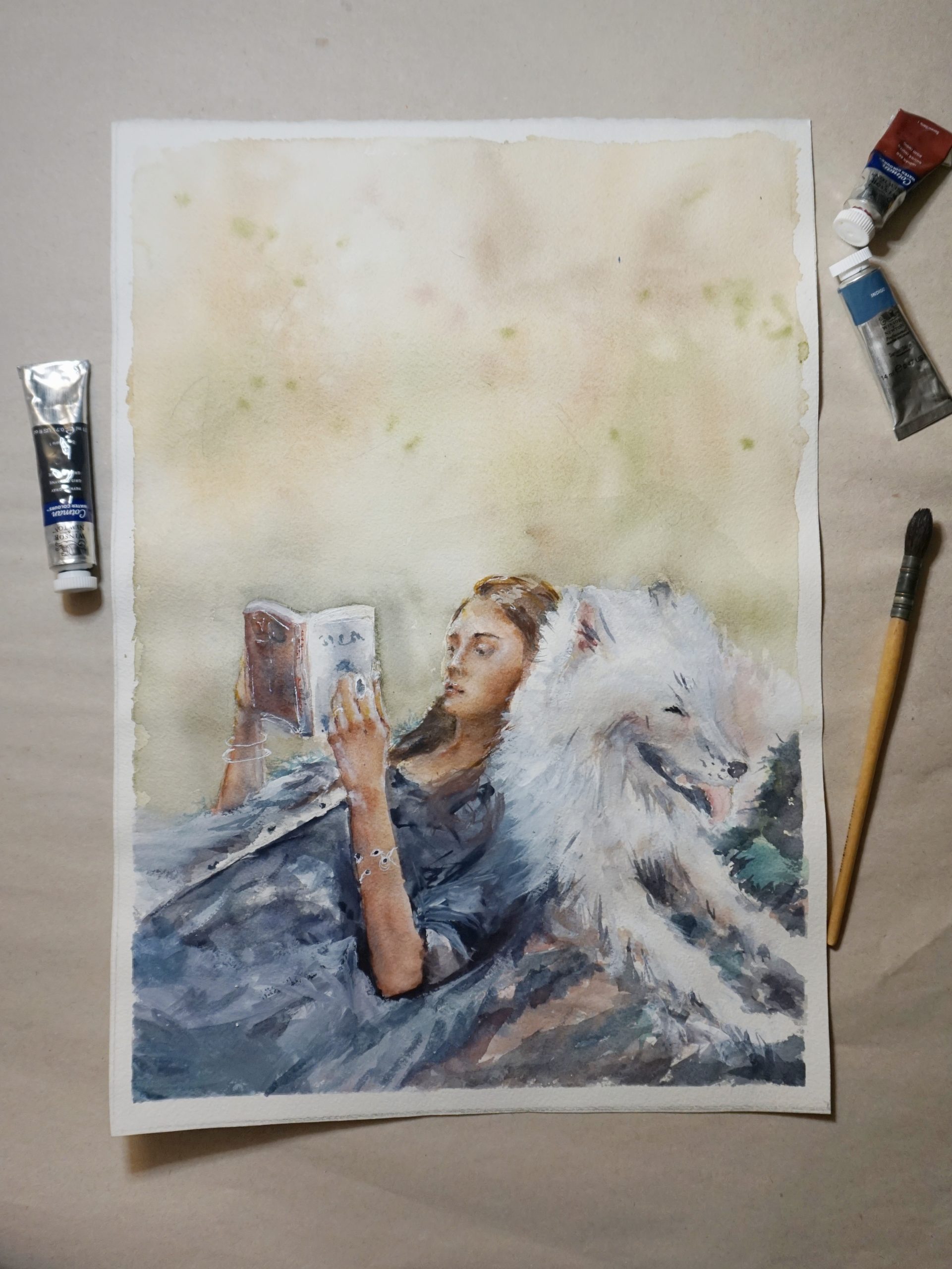 Aquarell Kunstwerk Frau liest Buch mit Hund auf einer Wiese